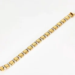 Bracelet en or jaune, or gris et diamants