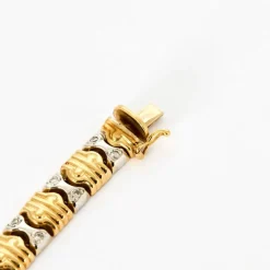Bracelet en or jaune, or gris et diamants