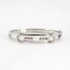 Bracelet jonc en or gris ajouré de perles de culture et diamants
