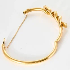 Bracelet jonc motif serpent en or jaune et rubis