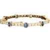 Bracelet jonc ouvrant en or jaune et argent, diamants et saphirs