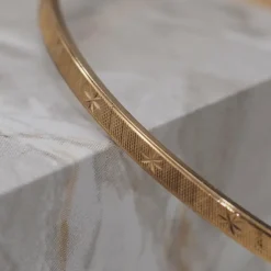 Bracelet jonc étoile en or jaune