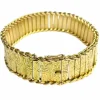 Bracelet manchette en or jaune à décor floral