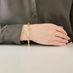 Bracelet moderniste en or jaune et gris, et diamants