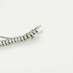 Bracelet or gris diamants et émeraudes