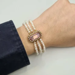Bracelet or rose 18 carats serti de perles fines et pierre rose