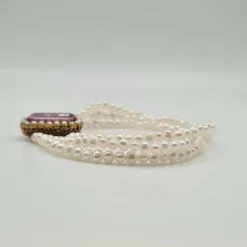 Bracelet or rose 18 carats serti de perles fines et pierre rose