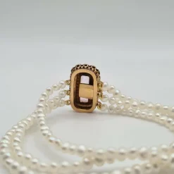 Bracelet or rose 18 carats serti de perles fines et pierre rose
