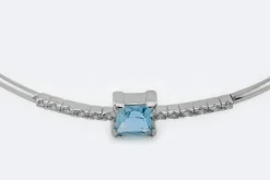 Bracelet rigide en or blanc avec topaze bleue et zircons