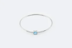 Bracelet rigide en or blanc avec topaze bleue et zircons
