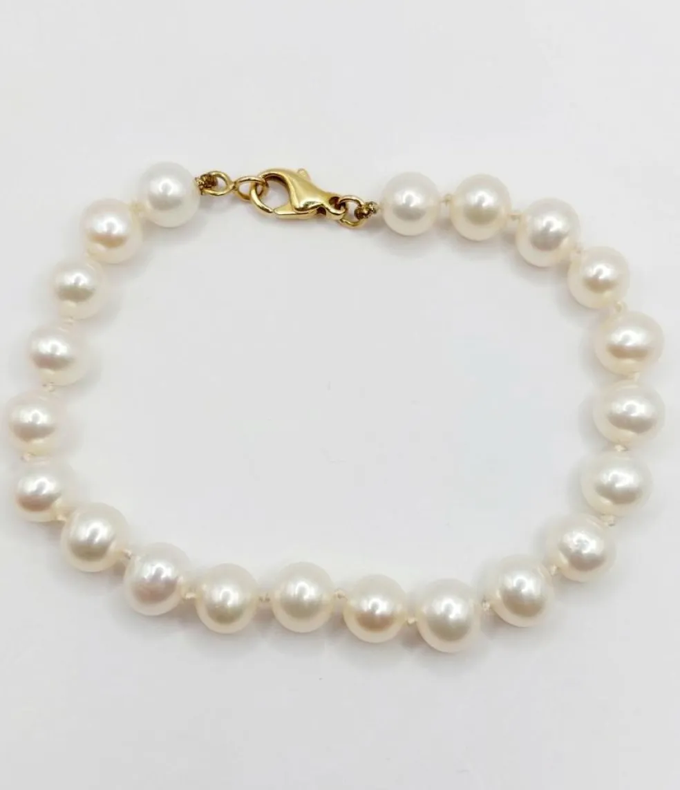 Bracelet vintage or jaune orné de perles de cultures
