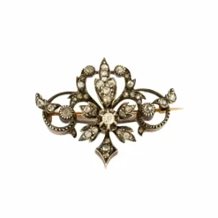 Broche à volutes, or rose et diamants