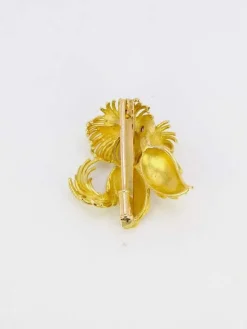 Broche animalière chien or jaune rubis