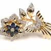 Broche Années 70 en or jaune sertie de saphirs et de diamants