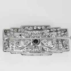 Broche art déco en platine, diamants et saphir