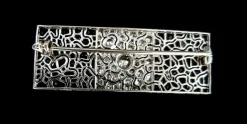 Broche Art Déco en platine sertie de saphirs et diamants