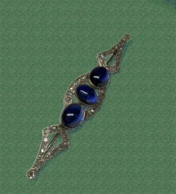 Broche Art Déco or, platine, cabochons saphirs