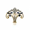 Broche Art Nouveau en or jaune, saphirs, diamants taille rose et perles