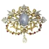 Broche avec deux sphinges diamant, saphir