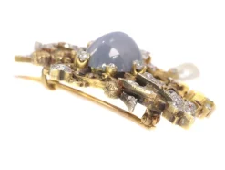 Broche avec deux sphinges diamant, saphir