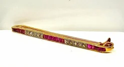 Broche barette en or 18 carats, 15 rubis , 10 diamants