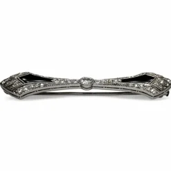 Broche barrette Art-Déco en platine, diamants et onyx.