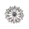 Broche en or blanc et pierres bleues