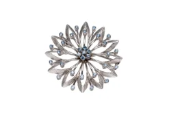 Broche en or blanc et pierres bleues