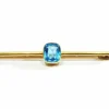 Broche en or et pierre synthétique