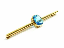 Broche en or et pierre synthétique
