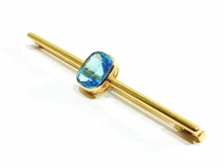Broche en or et pierre synthétique