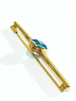 Broche en or et pierre synthétique