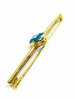 Broche en or et pierre synthétique