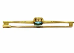 Broche en or et pierre synthétique