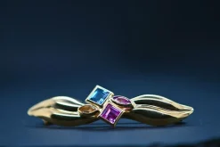 Broche en or jaune 18 carats, ornée de topaze bleue, tourmalines roses et quartz orange