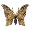 Broche en or jaune, diamants naturels jaunes, cognac et noirs