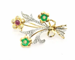 Broche en or jaune et blanc avec diamants et rubis