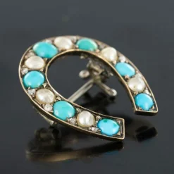 Broche fer à cheval turquoises perles fines diamants