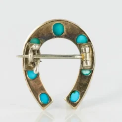 Broche fer à cheval turquoises perles fines diamants