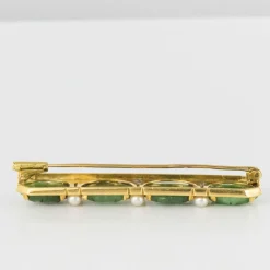 Broche ligne de jades et perles