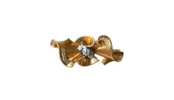 Broche noeud or rose, platine et diamants