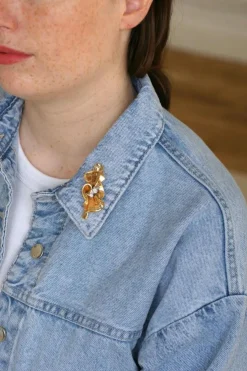 Broche noeud or rose, platine et diamants