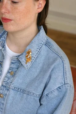 Broche noeud or rose, platine et diamants