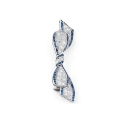 Broche nœud Art Déco platine, diamant, saphirs calibrés
