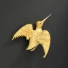Broche oiseau en or jaune