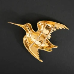 Broche oiseau en or jaune