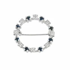 Broche or gris, pierre blanches et saphirs