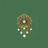Broche or, émeraude, perles fines