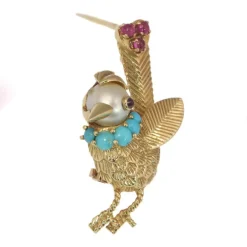 Broche ornée de bijoux