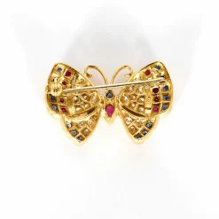 Broche Papillon or jaune, saphirs, rubis